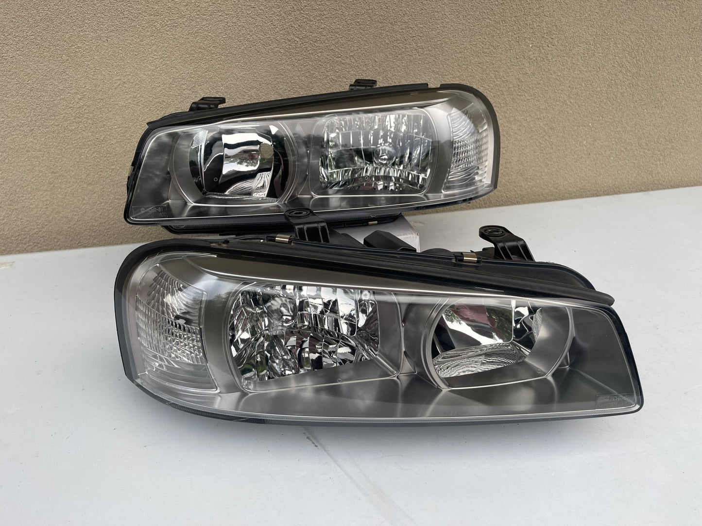 R34 NON XENON SERIES 2 HEAD LIGHT PAIR