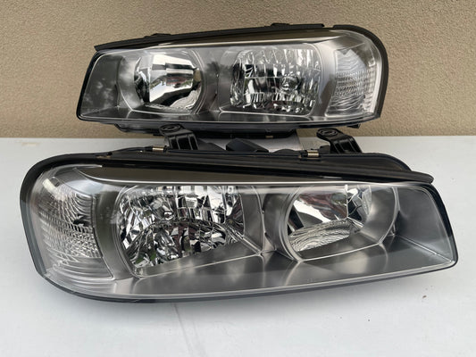 R34 NON XENON SERIES 2 HEAD LIGHT PAIR